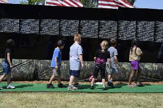Kids visiting The Moving Wall