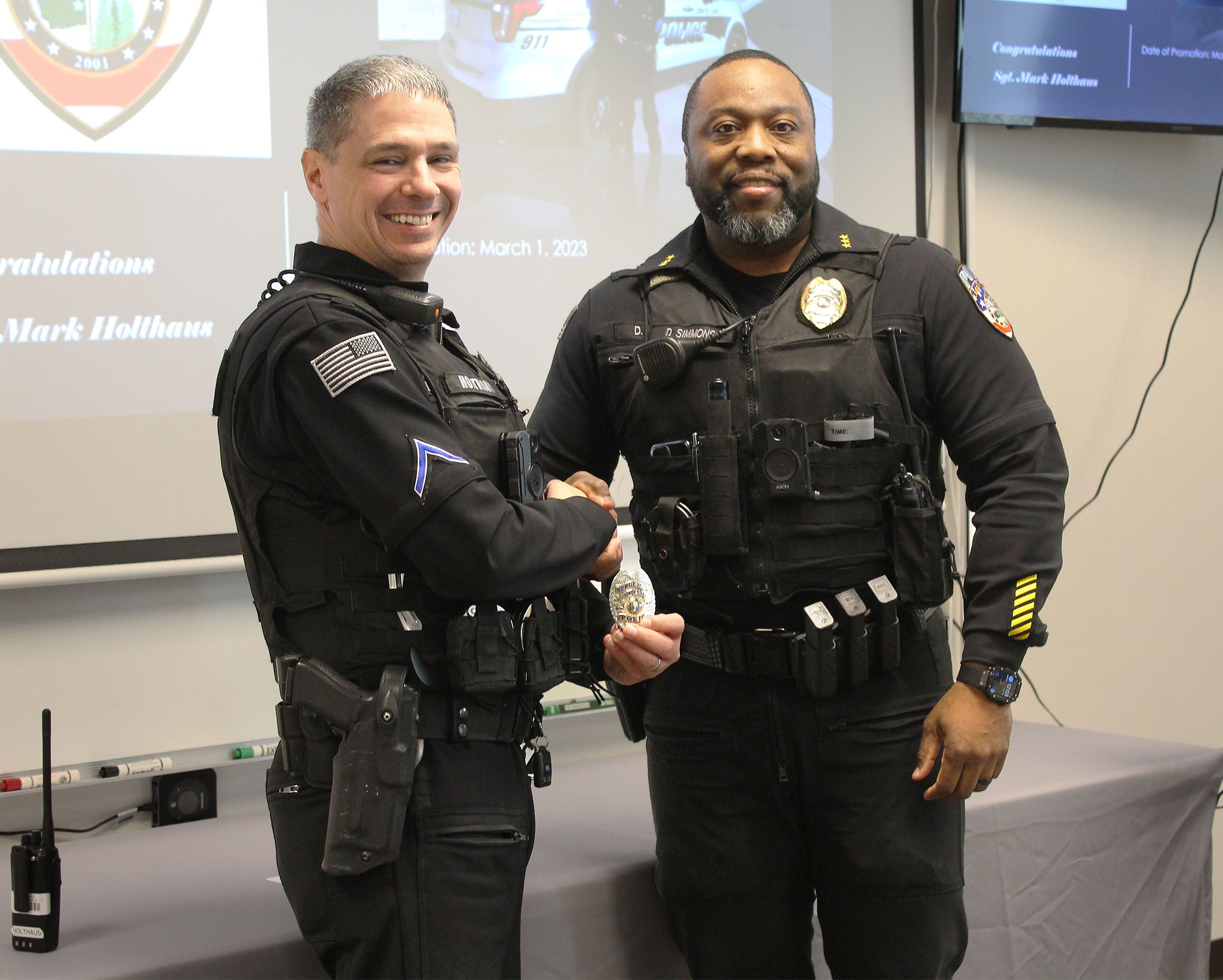 Sgt. Mark Holthaus and Police Chief Damon Simmons