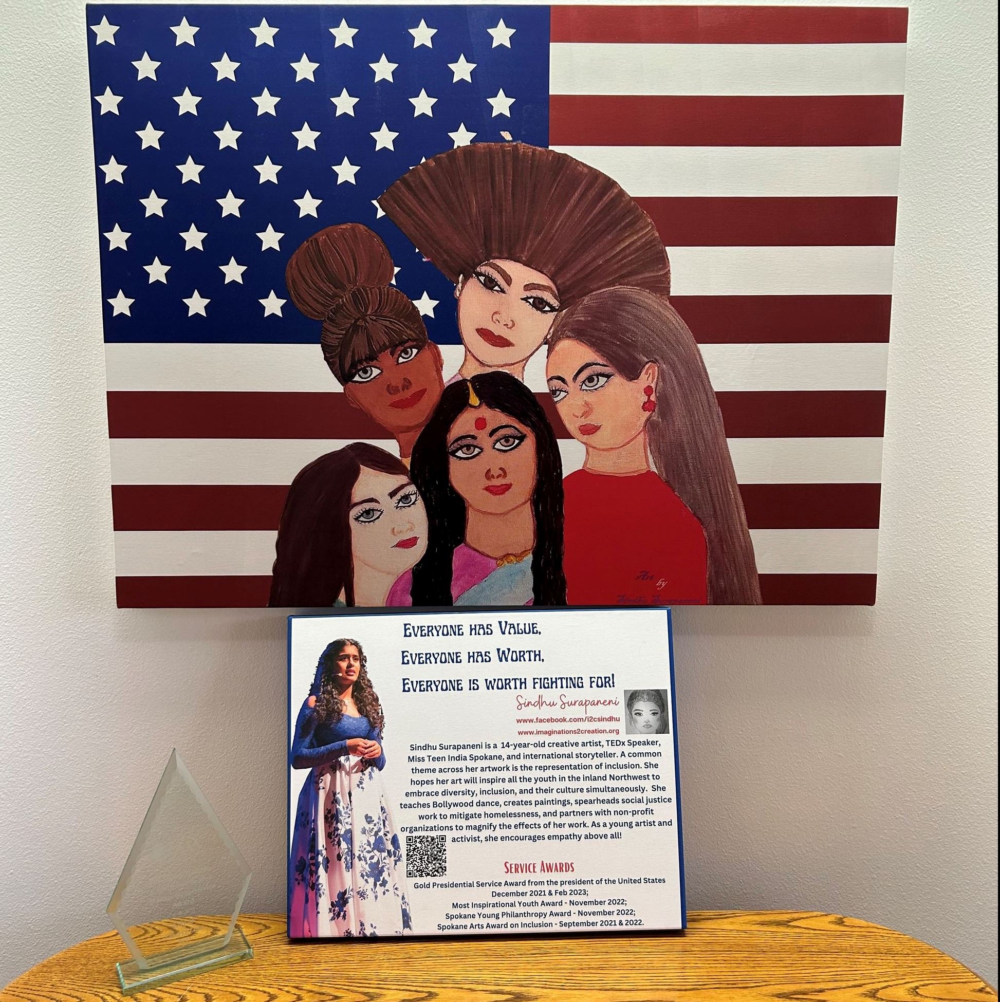 Painting of American Flag with 4 Females in front of it.