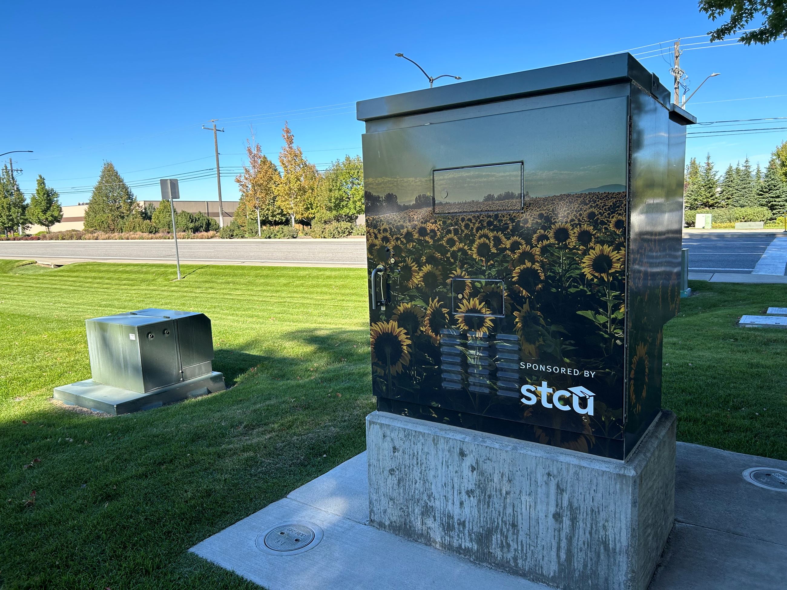 Image Sunflower Fields wrapped around a Signal Box.