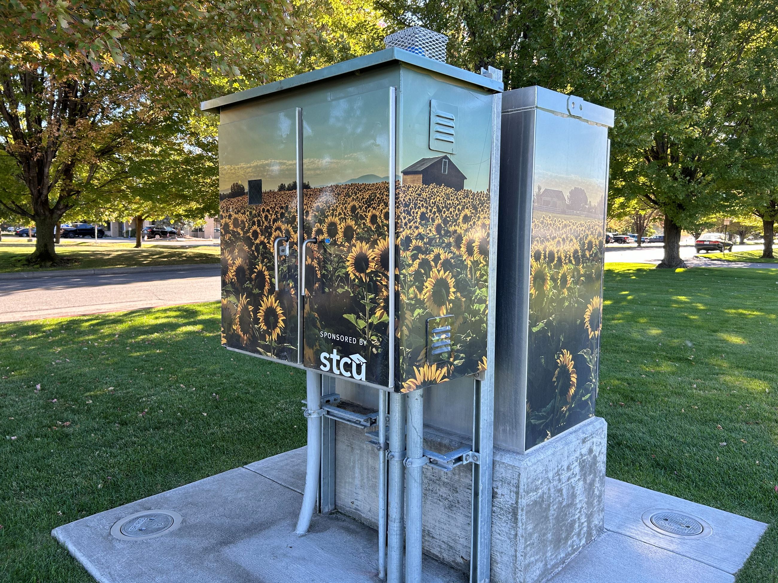 Image Sunflower Fields wrapped around a Signal Box.