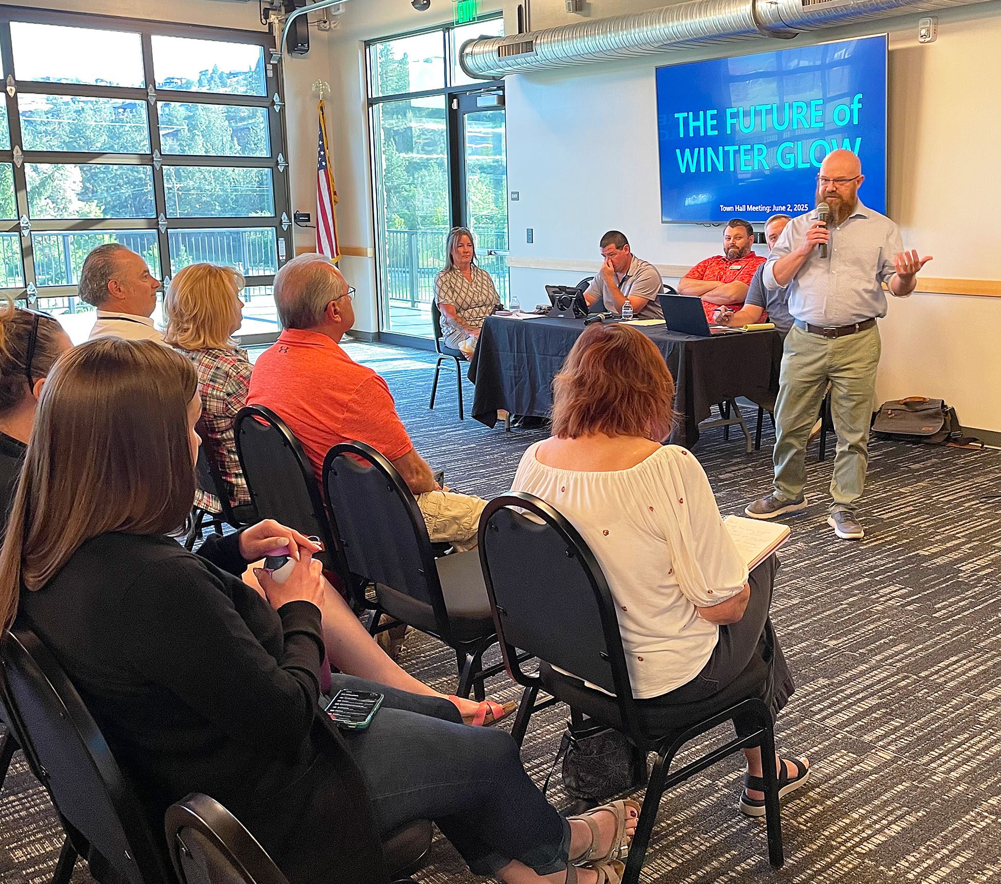 Speakers and audience at Winter Glow Town Hall meeting